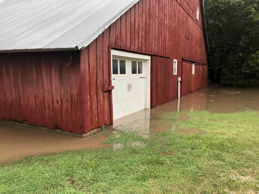 Kate Weis’s family’s barn stands in water after the July 4 flood. The flooding cancelled the family’s Fourth of July plans. 