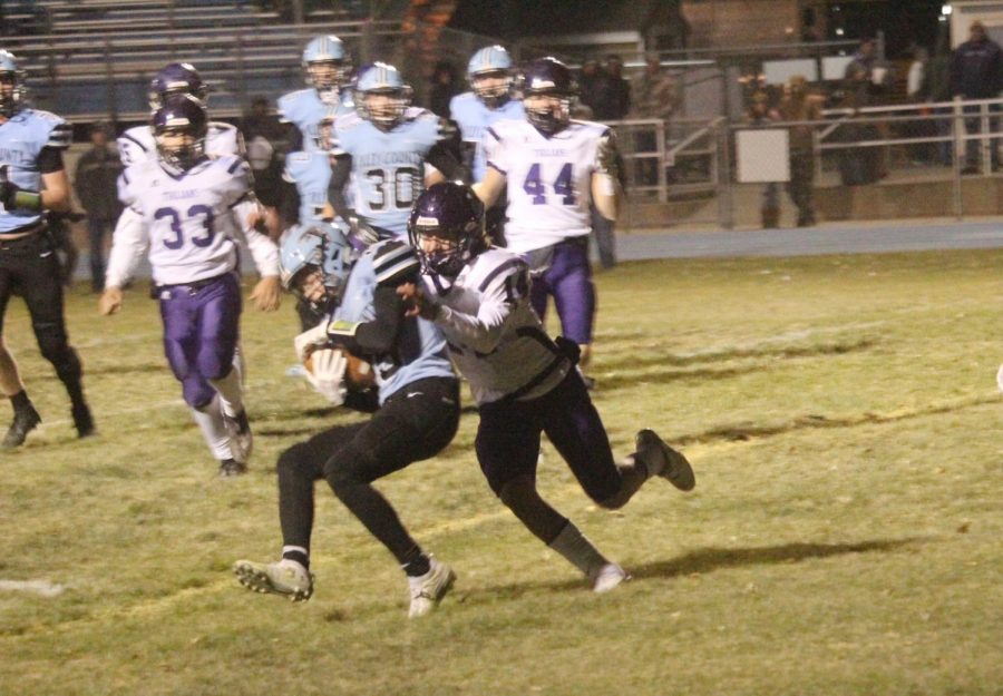 Jaxson Gebhardt tackles a Riley County player during Fridays game.