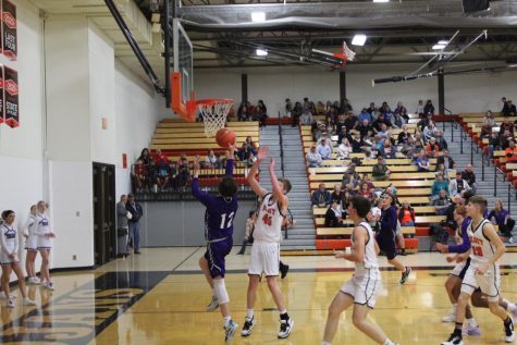 Senior Kayson Lilley jumps up for two against Beloit.